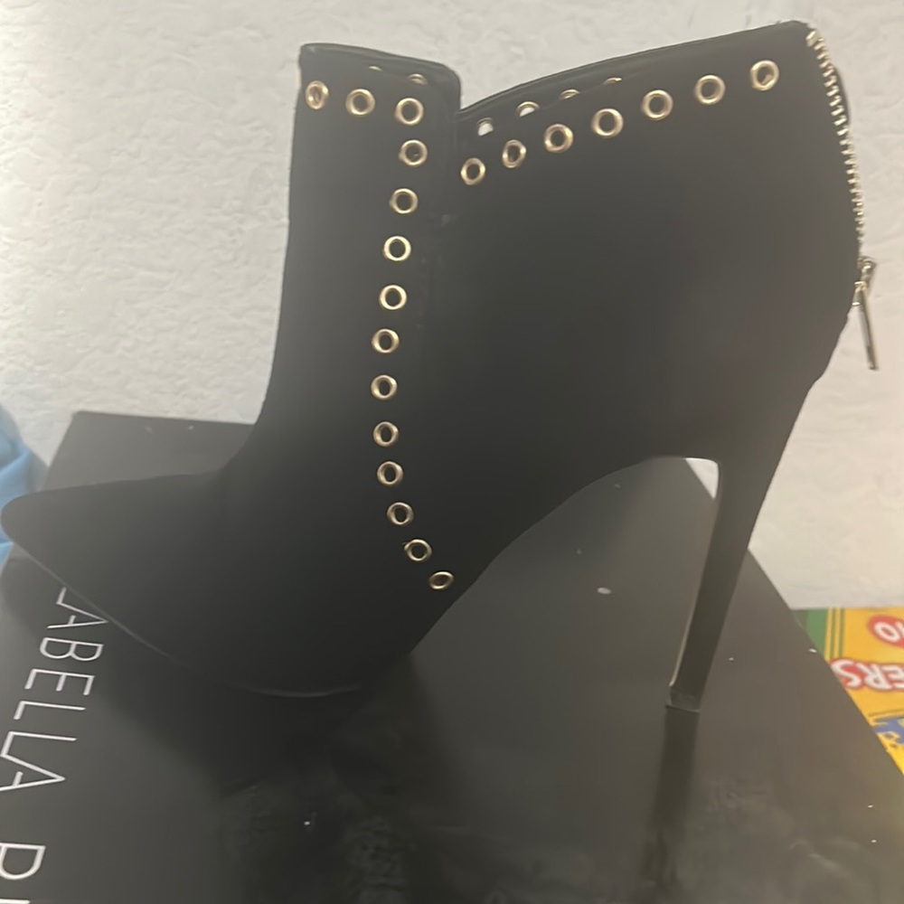 Black booties, gold button zip up back.